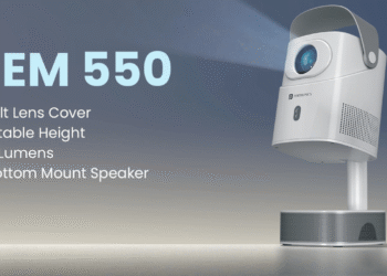 Beem 550 smart projector by Portronics displayed on a tabletop in a living room setup