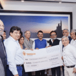 NAREDCO Maharashtra President Prashant Sharma presents ₹3.12 crore donation cheque to CM Relief Fund team, supporting flood-affected farmers in Maharashtra