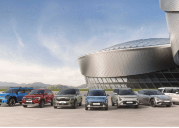 Atul Sood of Kia India with Sonet, Carens Clavis and Seltos lineup, celebrating record-breaking 29,556 unit sales milestone in October 2025