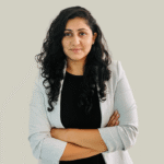 Students applying to universities abroad, reviewing acceptance letters and financial documents, with visuals of global campuses and online loan application platforms.